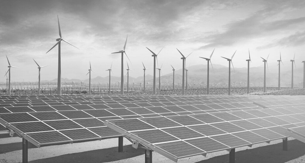 Solar panels and wind turbines producing green energy